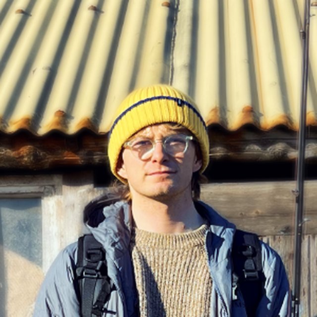 Lyle Swan in a yellow beanie and glasses